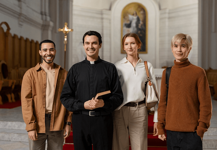 A pastor standing with three church members